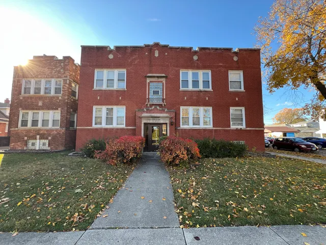 a front view of a building with garden