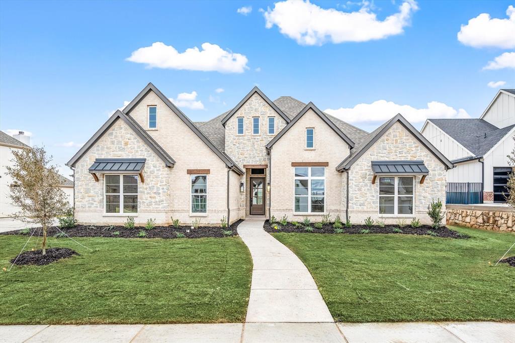 273 Carrington Drive Argyle, TX 76226 - Photo 1 of 1 a front view of a house with a garden and trees