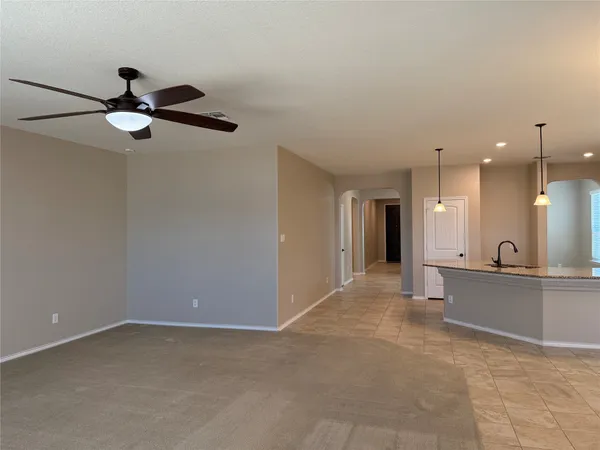 a view of a kitchen with a sink hardwood floor and a window