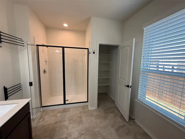 a view of an empty room with a window
