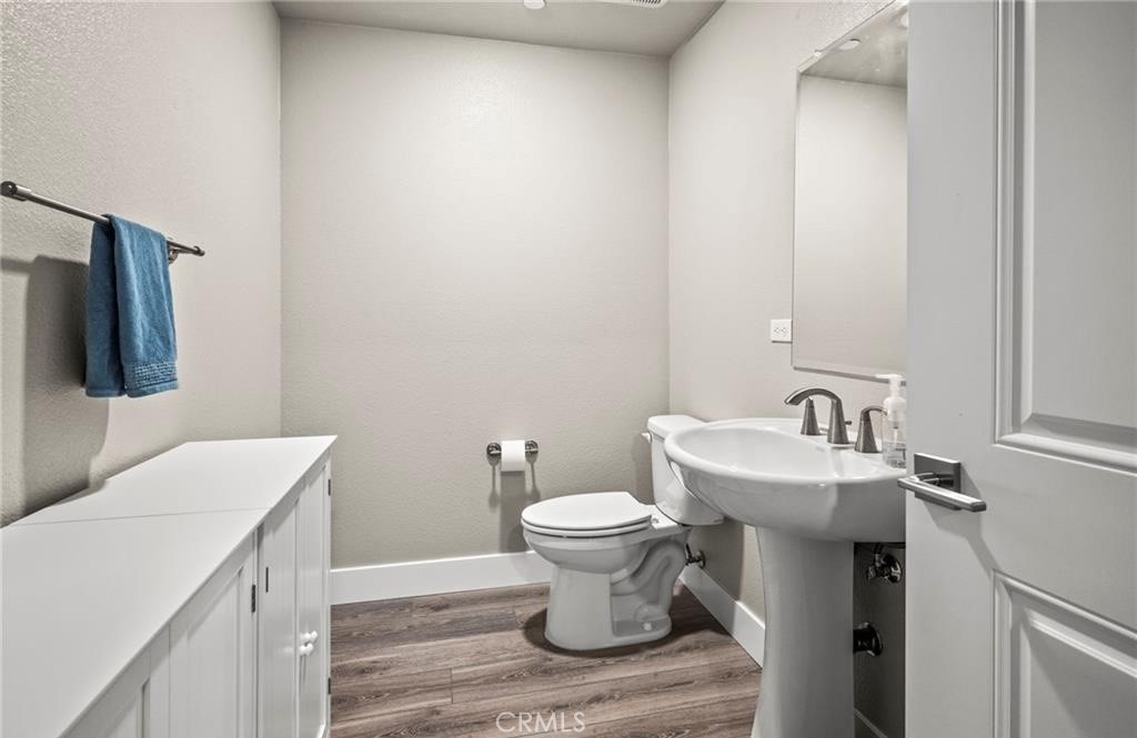 1661 Spring Street, Unit 444 Davis, CA 95616 - Photo 5 of 16 a bathroom with a sink toilet and a mirror