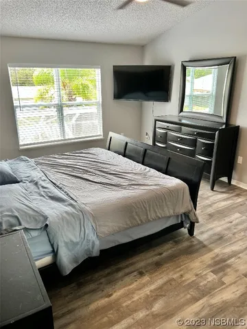 a view of a hallway view with wooden floor and staircase