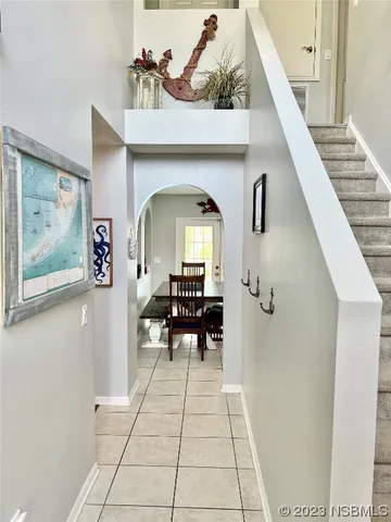 a view of living room with furniture and a potted plant