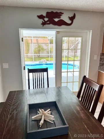a view of a balcony with furniture