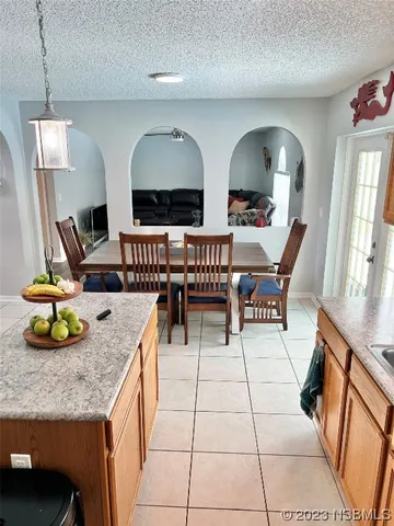 a view of a kitchen with dining area