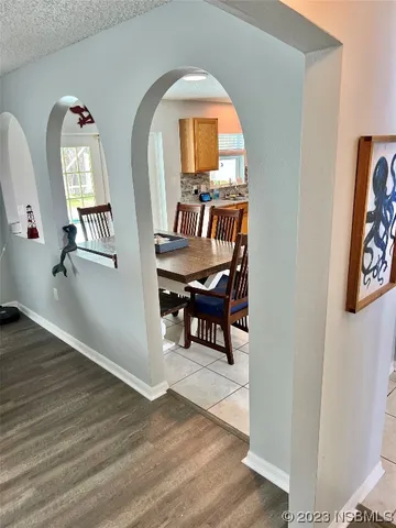 a view of a livingroom with furniture and a workspace