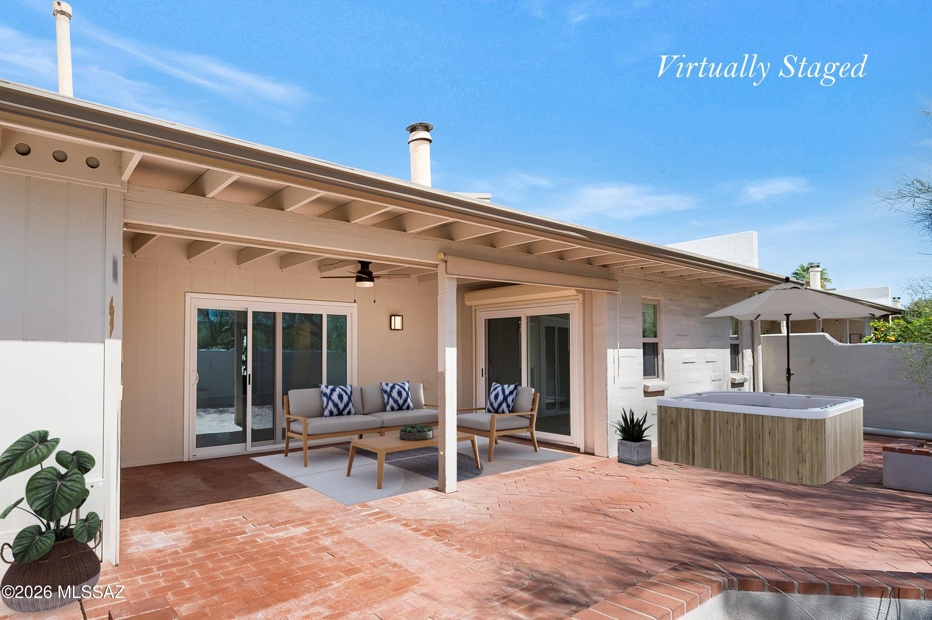 7408 East Wandering Road Tucson, AZ 85750 - Photo 22 of 25 a view of a house with backyard porch and sitting area