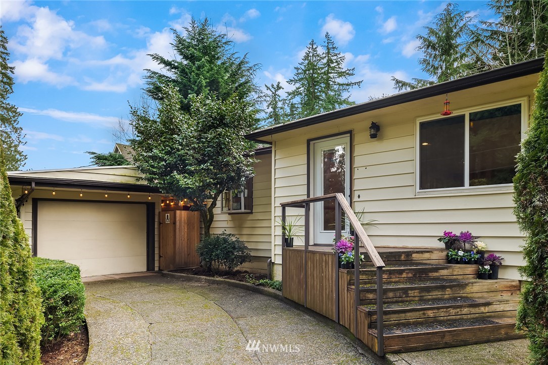 a view of a house with wooden fence
