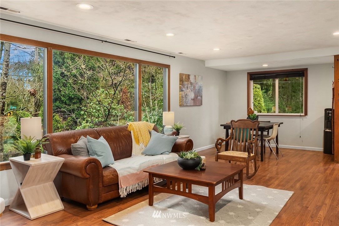 19607 Southeast 149th Street Renton, WA 98059 - Photo 12 of 34 a living room with furniture and a large window