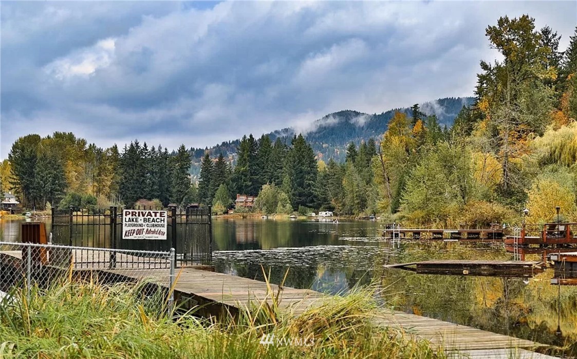 19607 Southeast 149th Street Renton, WA 98059 - Photo 5 of 34 a view of a lake with houses in the back