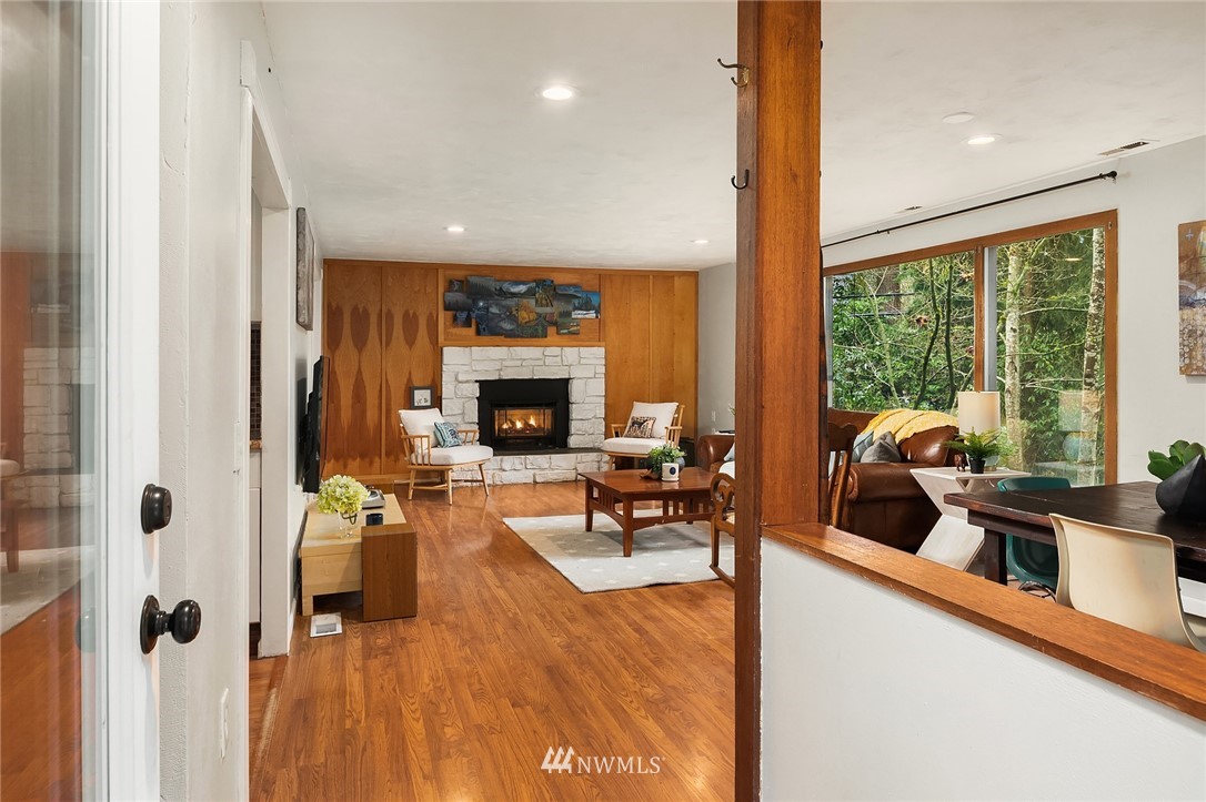 19607 Southeast 149th Street Renton, WA 98059 - Photo 6 of 34 a living room with furniture fireplace and a large window