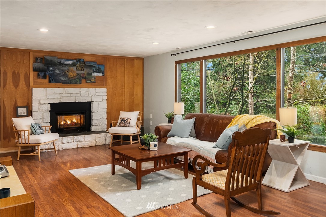 19607 Southeast 149th Street Renton, WA 98059 - Photo 8 of 34 a living room with furniture and a fireplace
