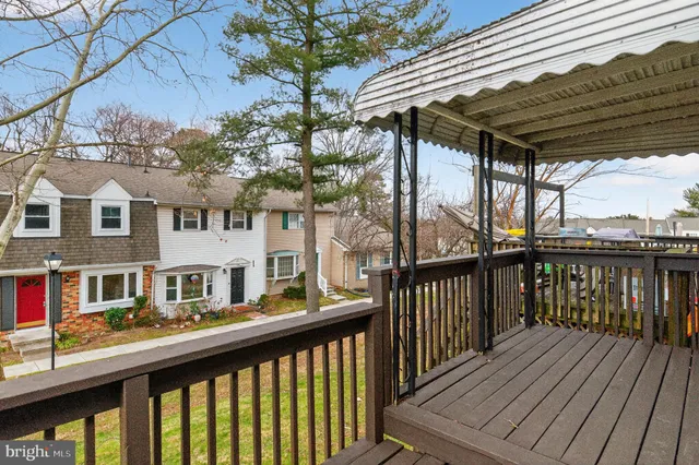 a view of a deck with wooden floor and outdoor seating