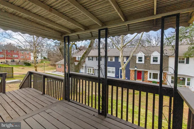 a view of a porch with wooden floor