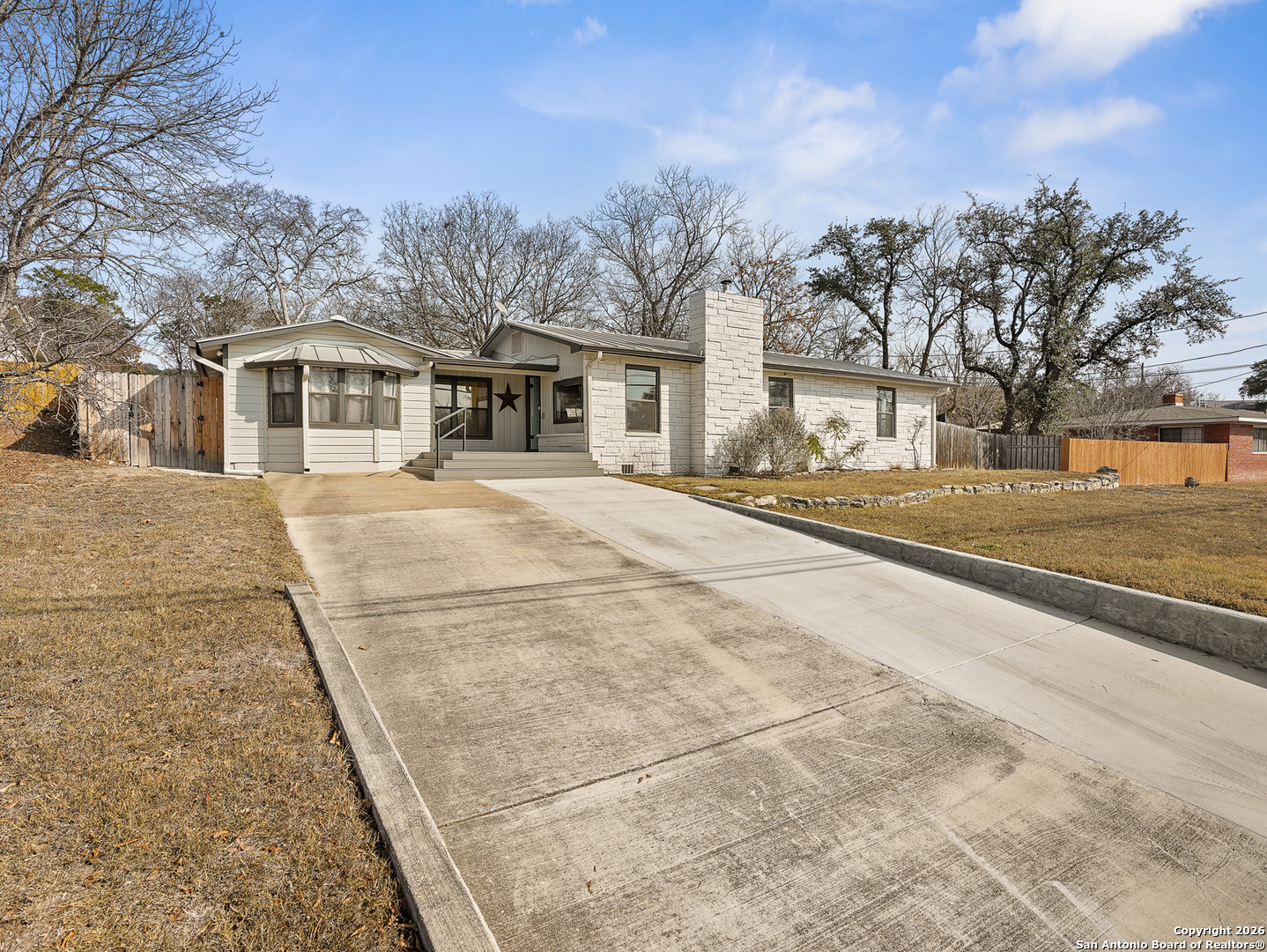 1514 Glen Road Kerrville, TX 78028 - Photo 1 of 1 a front view of a house with a yard and trees