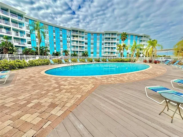 a view of a swimming pool with a yard