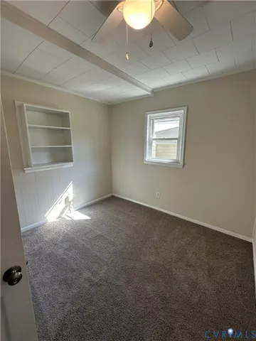 a view of empty room with windows
