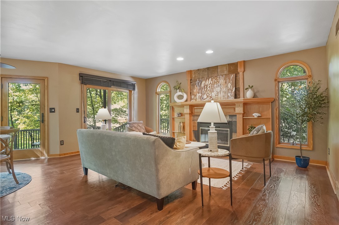 370 Wilcox Road Youngstown, OH 44515 - Photo 17 of 49 Living area with wood-type flooring, recessed lighting, and a glass covered fireplace