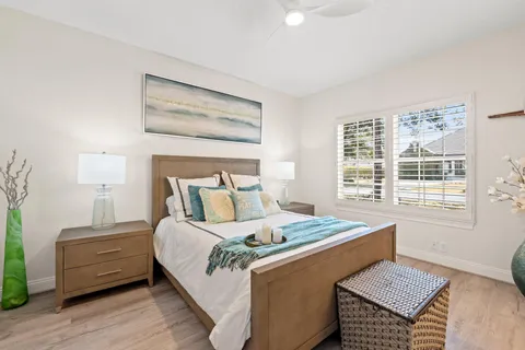 a bed room with a bed and a window
