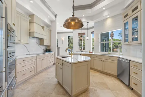 a kitchen with a sink and stove