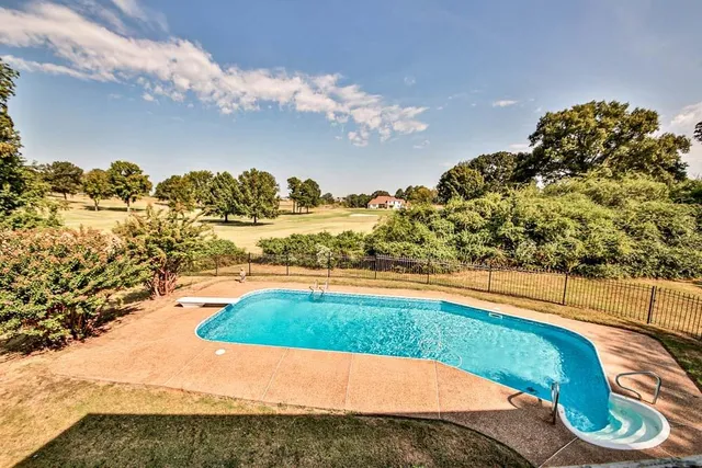 a view of a swimming pool from a balcony