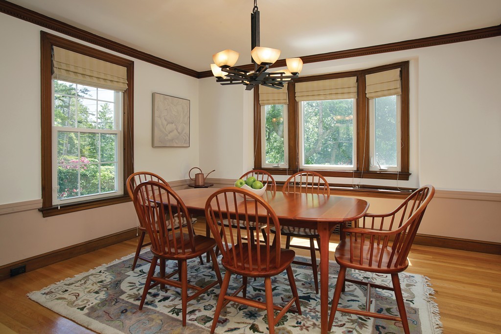 55 Welland Road Brookline, MA 02445 - Photo 4 of 9 a view of a dining room with furniture window and wooden floor