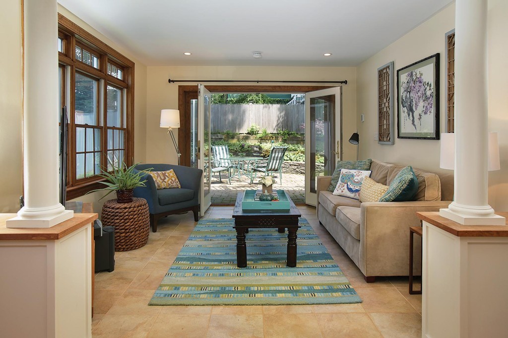 55 Welland Road Brookline, MA 02445 - Photo 7 of 9 a living room with furniture and a large window