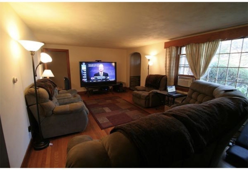 211 Russell Street Hadley, MA 01035 - Photo 7 of 23 a living room with furniture and a flat screen tv
