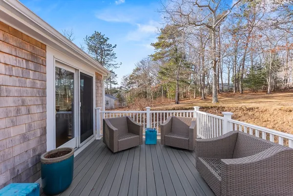 a kitchen with stainless steel appliances granite countertop a refrigerator a stove and a sink with wooden cabinets