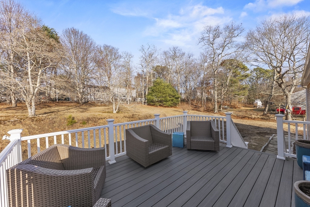 30 Pawtuxet Road Plymouth, MA 02360 - Photo 18 of 42 a view of balcony with furniture and wooden floor