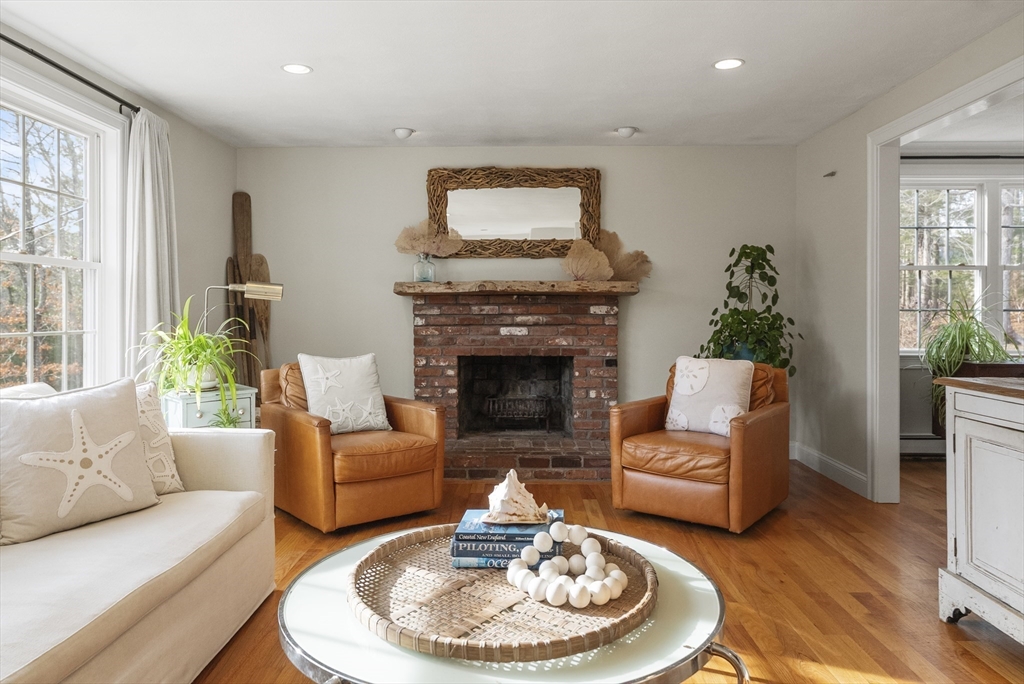 30 Pawtuxet Road Plymouth, MA 02360 - Photo 19 of 42 a living room with furniture a fireplace and a large window