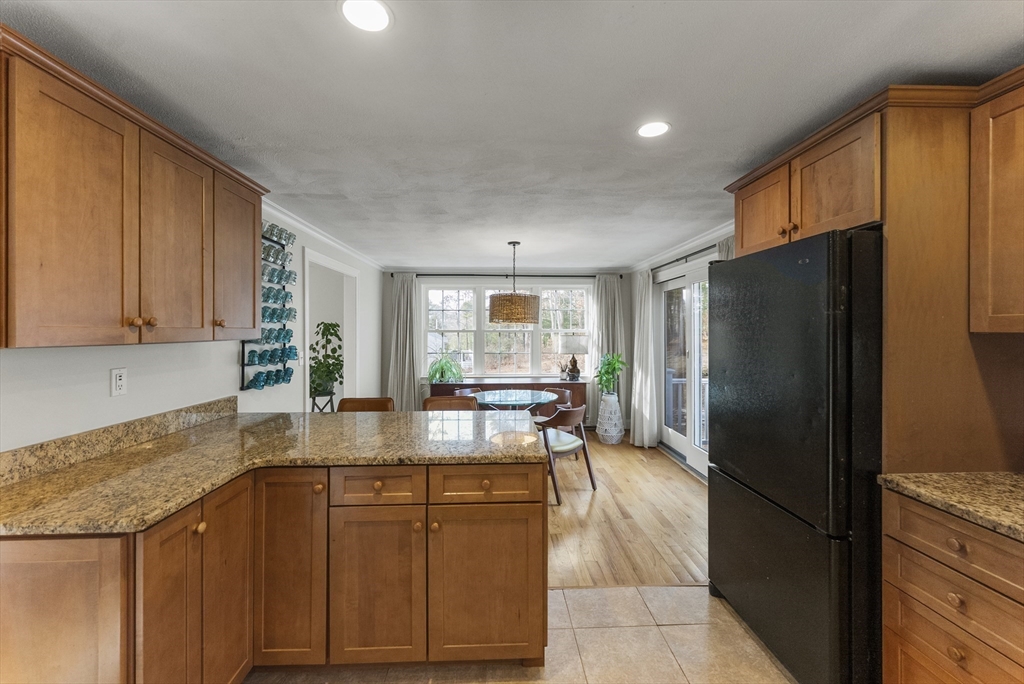 30 Pawtuxet Road Plymouth, MA 02360 - Photo 21 of 42 a kitchen with granite countertop a refrigerator and a sink