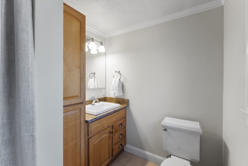 30 Pawtuxet Road Plymouth, MA 02360 - Photo 30 of 42 a bathroom with a sink a toilet and mirror