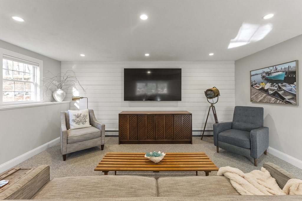 30 Pawtuxet Road Plymouth, MA 02360 - Photo 36 of 42 a living room with furniture and a rug