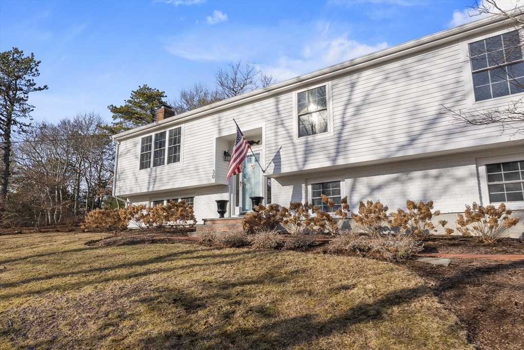 30 Pawtuxet Road Plymouth, MA 02360 - Photo 7 of 42 a front view of a building with lots of green space