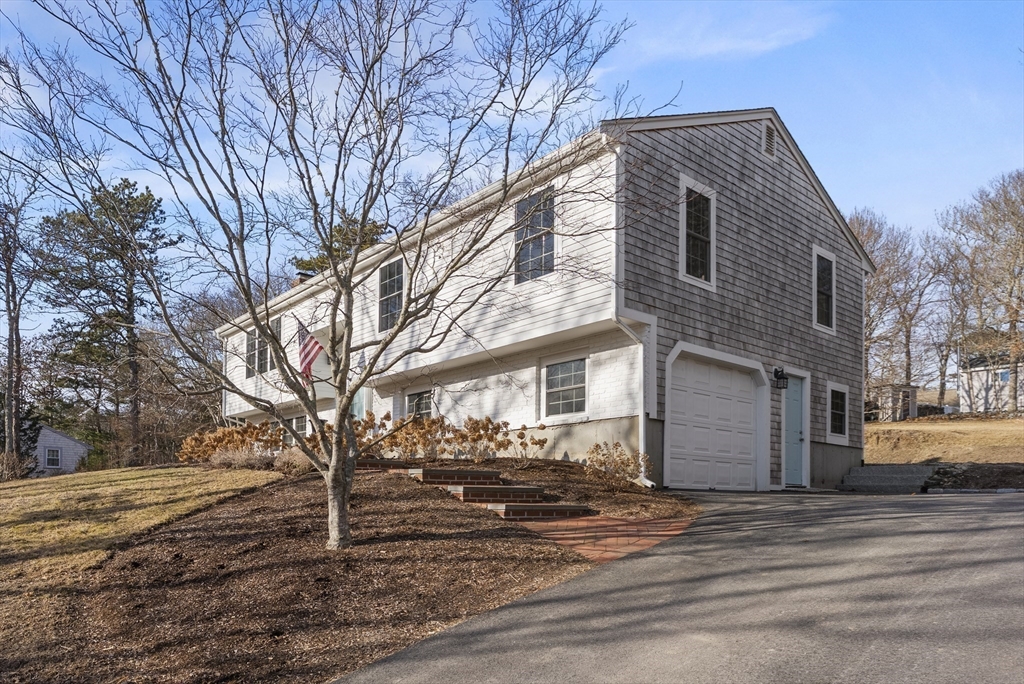 30 Pawtuxet Road Plymouth, MA 02360 - Photo 9 of 42 a front view of a house with a road