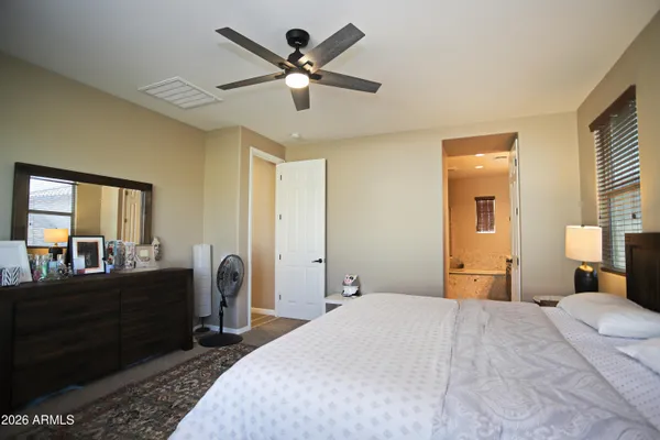 a view of a backyard with plants and outdoor seating