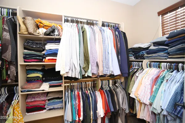 a view of a garage with rack and bicycle