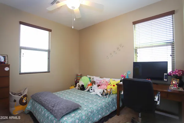 a view of a swimming pool with a lounge chair and tables
