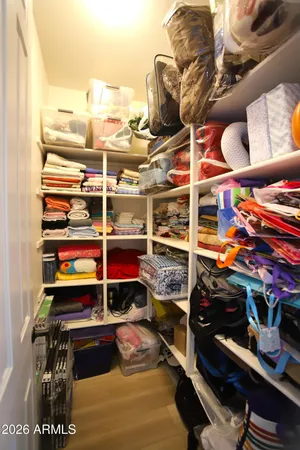 a view of a swimming pool and trees in the background