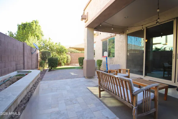 a view of road with a building and trees in the background