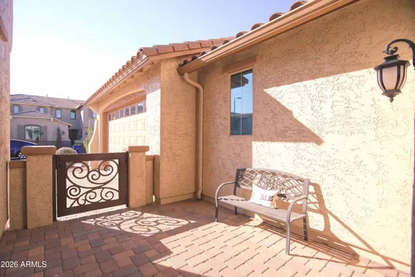 a living room with furniture a dining table and a chandelier