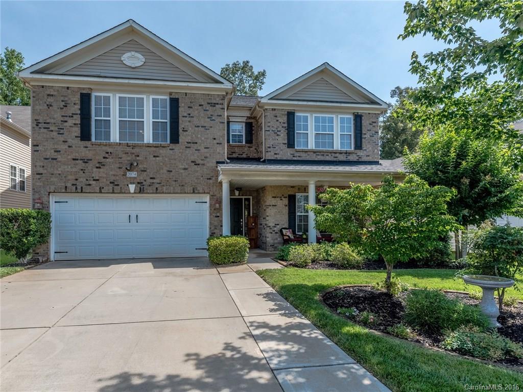 2074 Durand Road, Unit 18 Fort Mill, SC 29715 - Photo 1 of 24 a front view of a house with garden