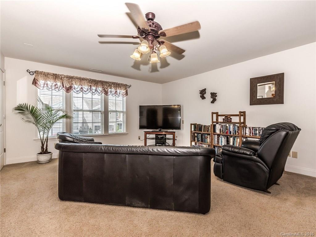 2074 Durand Road, Unit 18 Fort Mill, SC 29715 - Photo 15 of 24 a living room with furniture and a flat screen tv