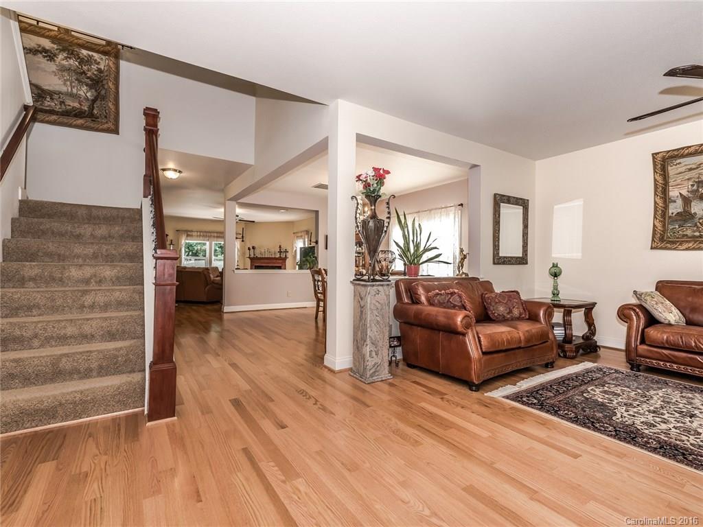 2074 Durand Road, Unit 18 Fort Mill, SC 29715 - Photo 3 of 24 a living room with furniture and wooden floor