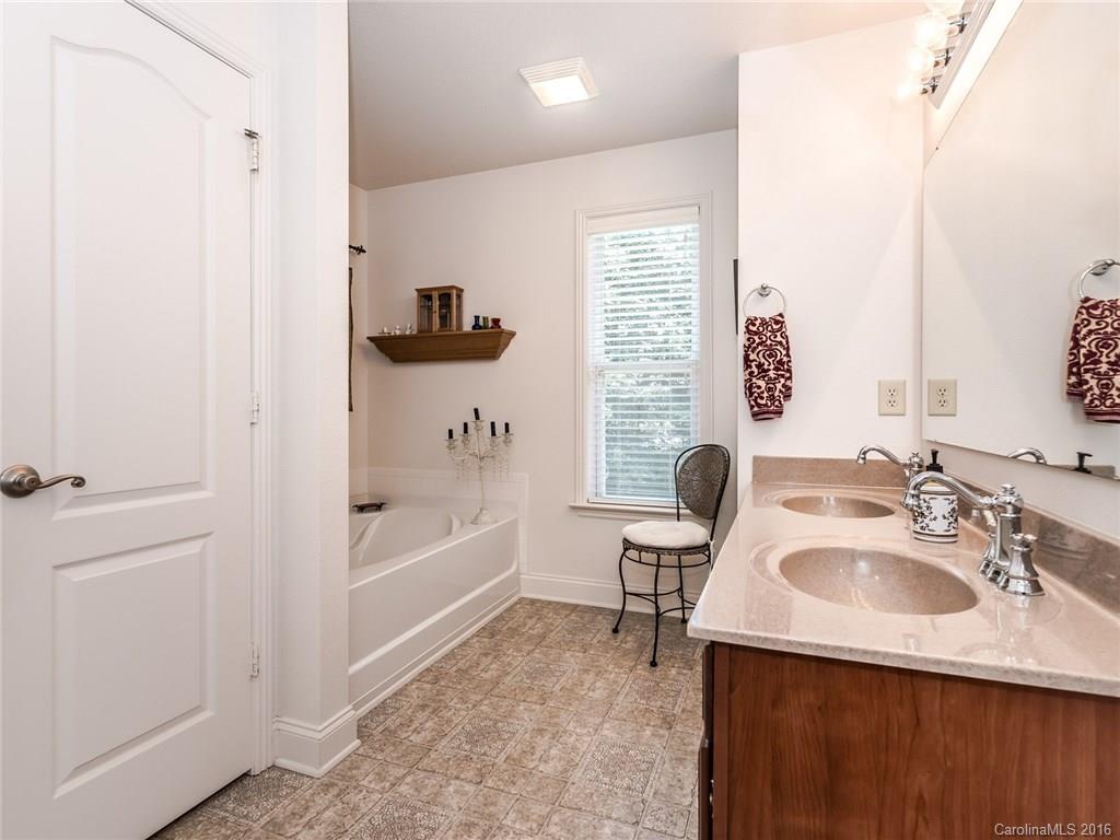2074 Durand Road, Unit 18 Fort Mill, SC 29715 - Photo 21 of 24 a bathroom with a sink and a bathtub