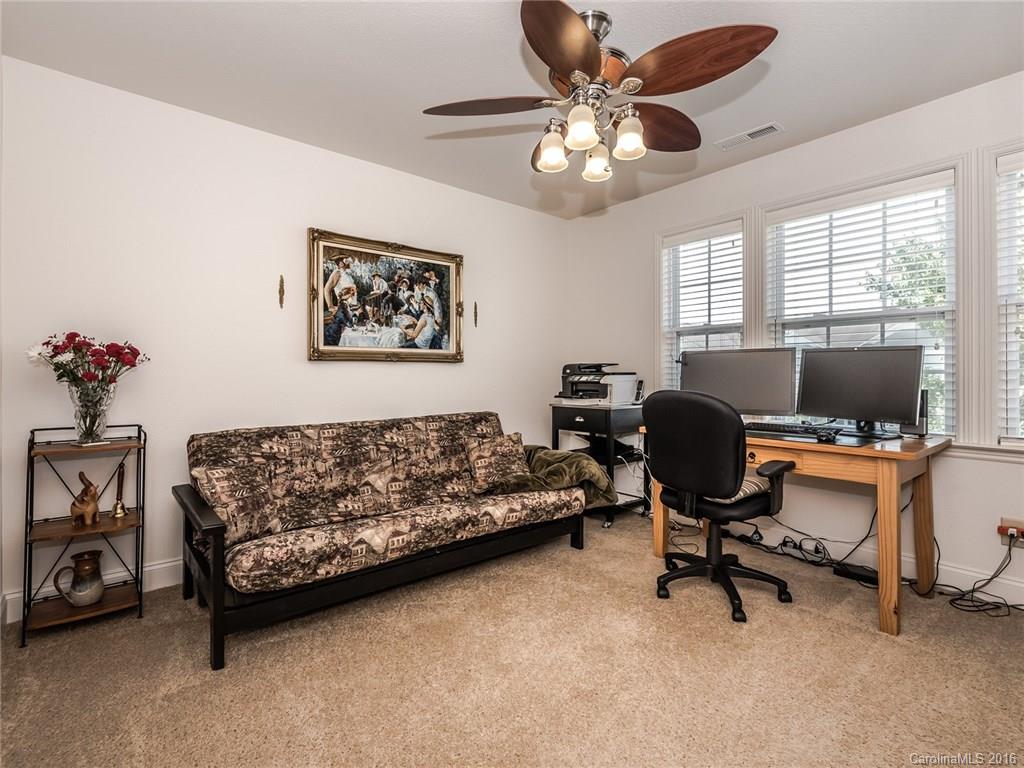 2074 Durand Road, Unit 18 Fort Mill, SC 29715 - Photo 22 of 24 a view of a livingroom with workspace and a window
