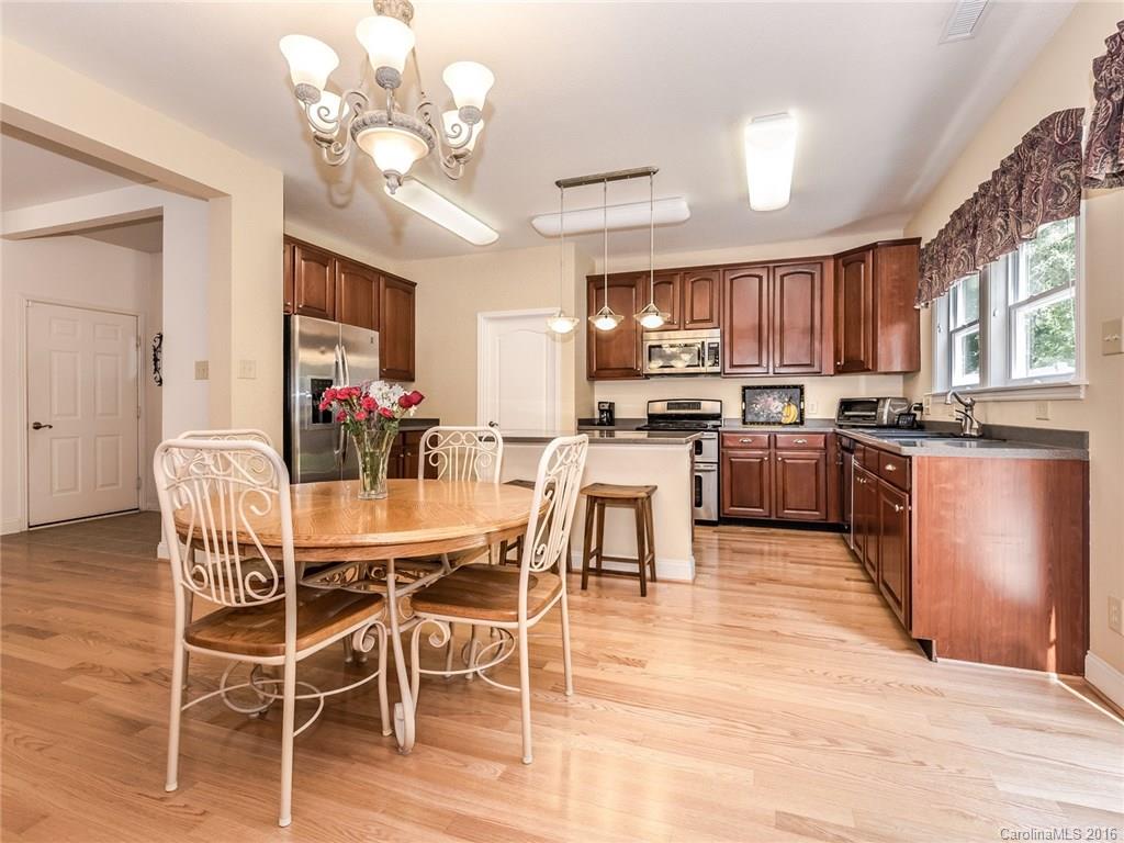 2074 Durand Road, Unit 18 Fort Mill, SC 29715 - Photo 8 of 24 a view of a dining room kitchen and a window