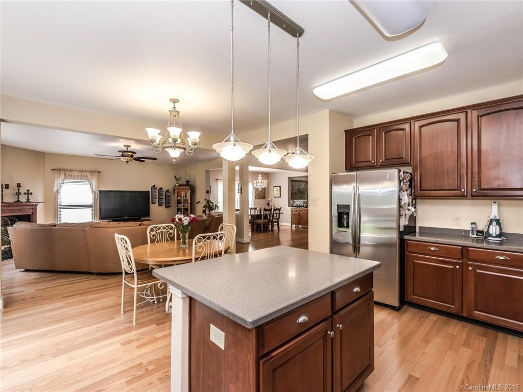 2074 Durand Road, Unit 18 Fort Mill, SC 29715 - Photo 10 of 24 a kitchen with stainless steel appliances granite countertop a sink a stove and a refrigerator