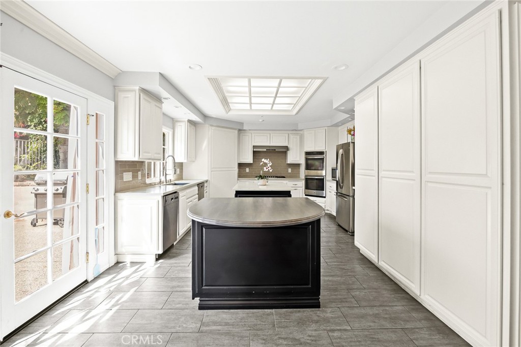 1531 Rodeo Road Arcadia, CA 91006 - Photo 18 of 34 a kitchen with stainless steel appliances granite countertop a refrigerator and a sink